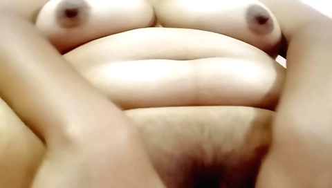 Indian brunette with a nice hairy pussy enjoys solo porn