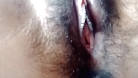 Indian babe is having fun on the bed in her own home