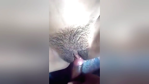 Indian girl with a hairy pussy fucks in the bedroom