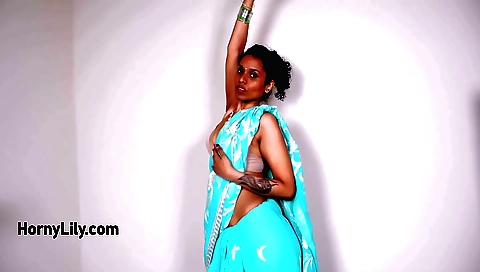 Indian slut with sexy dress dances in front of black webcam