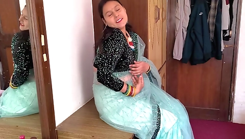 Indian girl in white dress and tattered white shorts