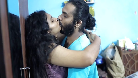 Tattooed brunette in red dress and pink blouse is having sex