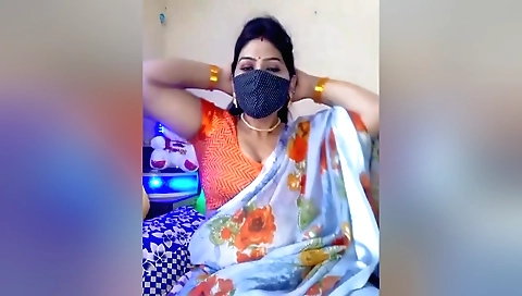 Charming bhabhi is showing us her big boobs and booty
