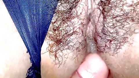 Amateur girl with a hairy pussy takes off her dress to show