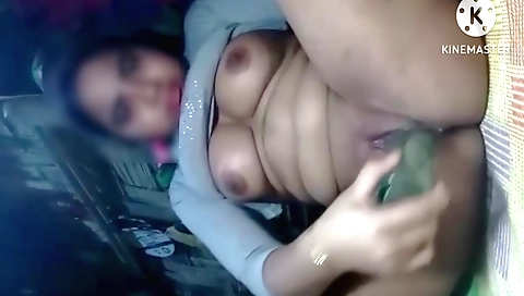 Indian girl masturbates herself with a toy in her mouth