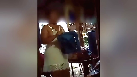 A brunette is showing off her big boobs in front of the camera