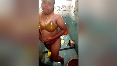 Indian solo blonde in the shower with a sexy dress