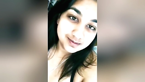 Sexy brunette solo webcam video showing her round boobs