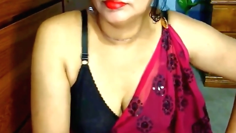 Indian brunette with a sexy figure shows her tits on webcam