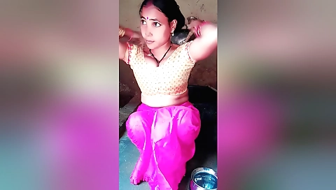 Brunette in a bathing suit has a nice bath in the bathtub