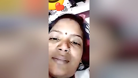 Indian girl in black dress gives a video call with her lover